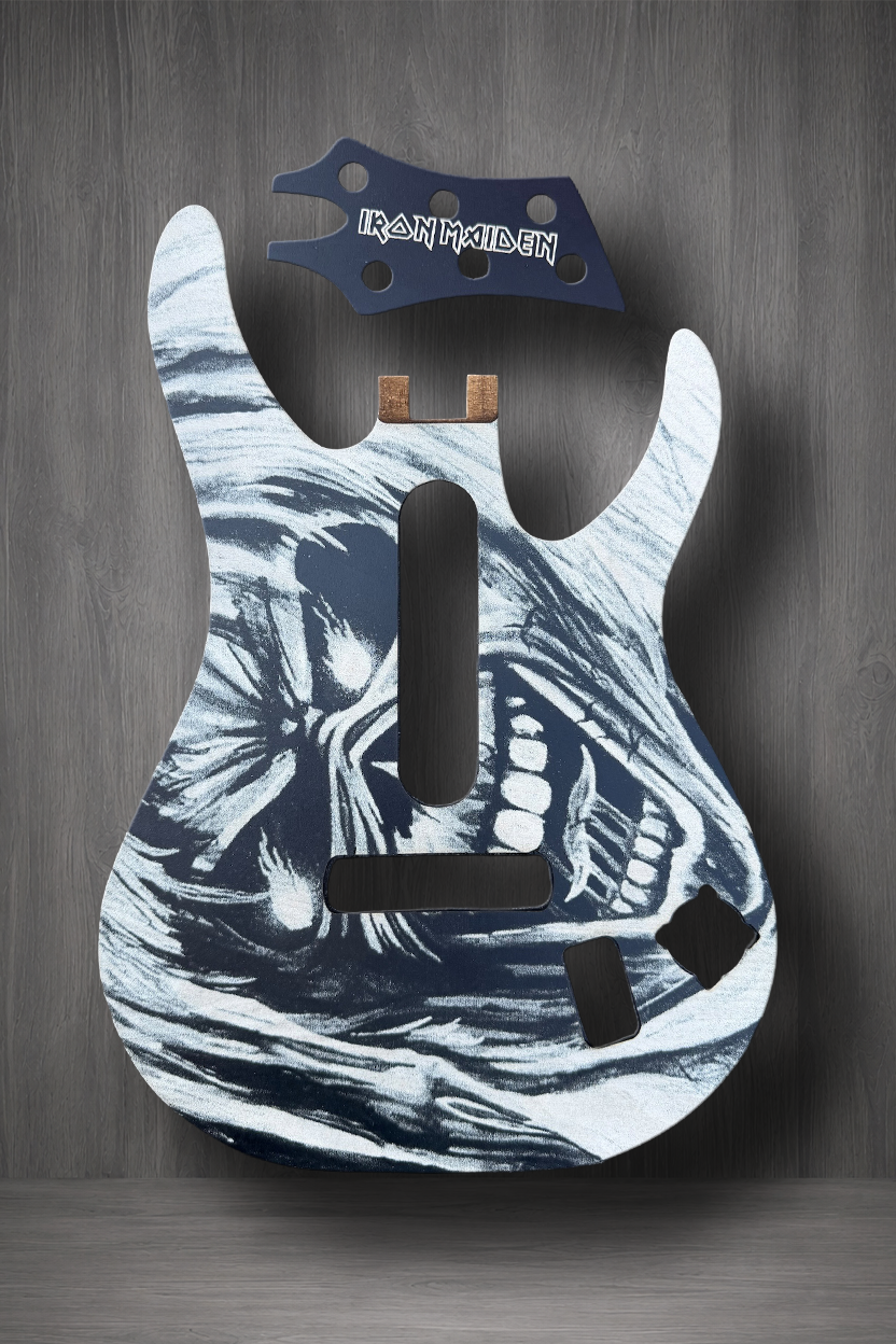 A custom MagnaPlate Set with a black and white graphic of the Iron Maiden's Eddie the Head, shown with a matching black headstock.